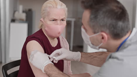 senior woman getting flu shot