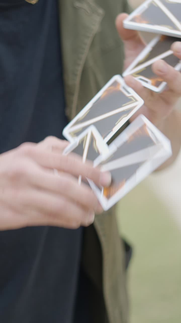 Close-up of a person shuffling and handling Yu-Gi-Oh! trading cards