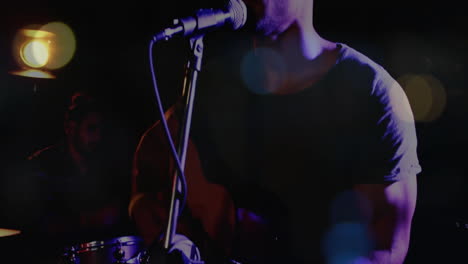 bandmates performing on dim stage in music business, with floating soundwave bars and drumkit icons