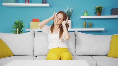 happy young woman listening to music with headphones.