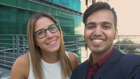 Cheerful-young-couple-smiling-and-talking-during-video-chat