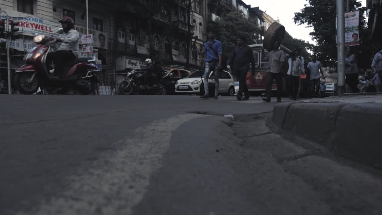Pedestrians and traffic from street level view India