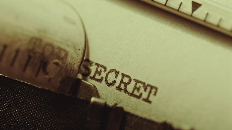Writing Top Secret Document on Paper with Retro Typewriter