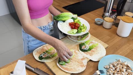 woman preparing healthy wraps