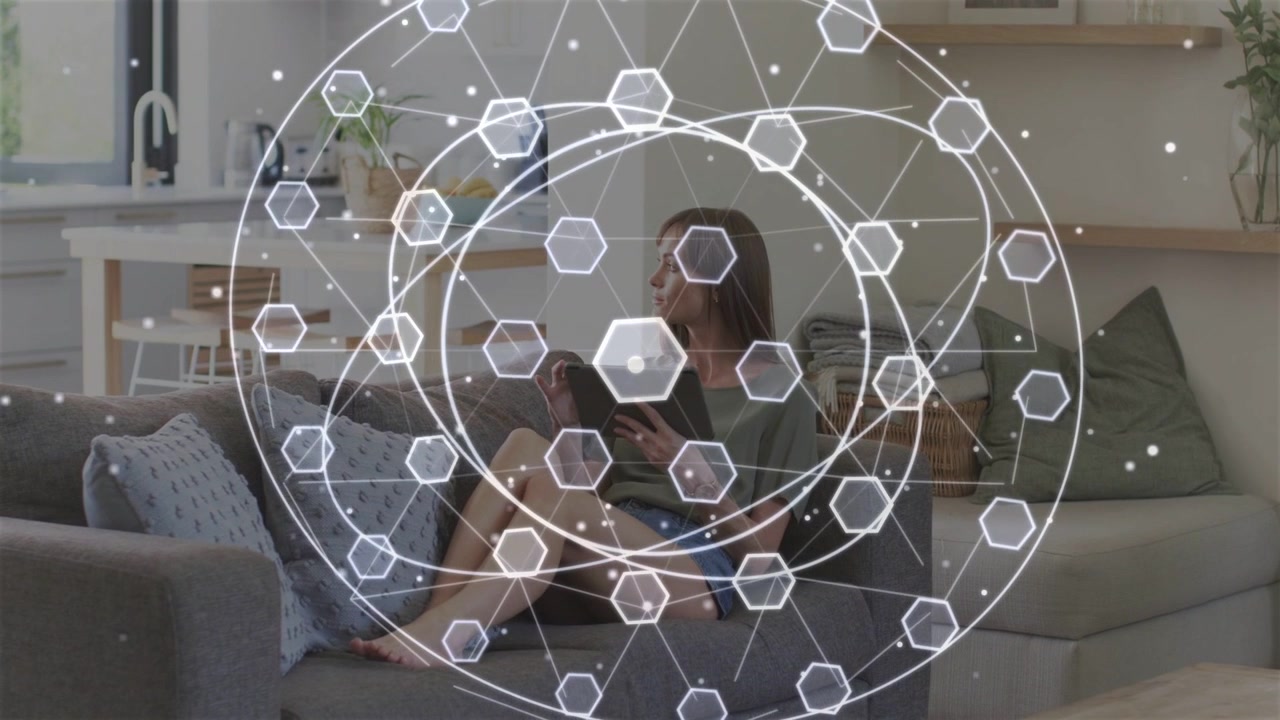 Mid-adult woman tapping tablet, expanding tech overlay of hexagons and rotating rings for data