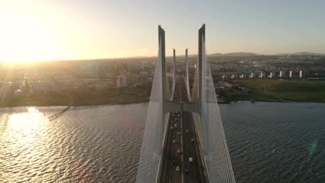 aerial drone video of ponte vasco da gama bridge with cars passing by