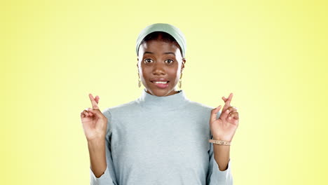 black woman, fingers crossed