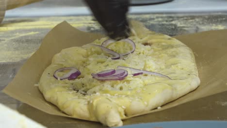 Preparing-a-traditional-Turkish-baked-pide-dish