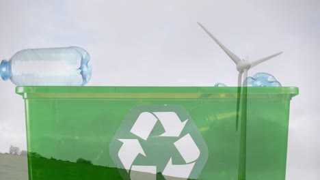 animación de un cartel de reciclaje verde sobre una caja con botellas de plástico y una turbina eólica