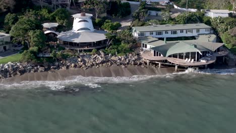 multi-million dollar mansions along coastline in malibu, california - aerial