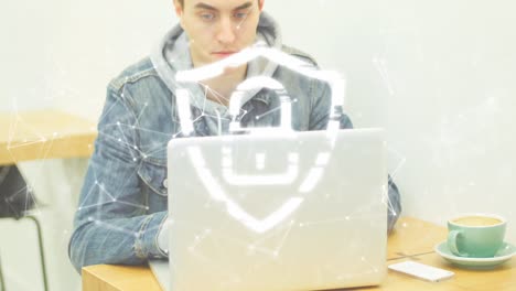 animation of padlock in shield and connected dots forming shapes over caucasian man using laptop