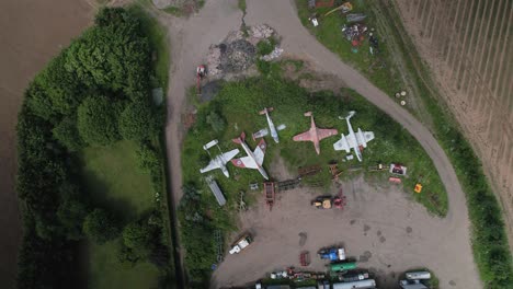 aerial shot of the abandoned royal air force military jets with de havilland vampire, gloster meteor, f