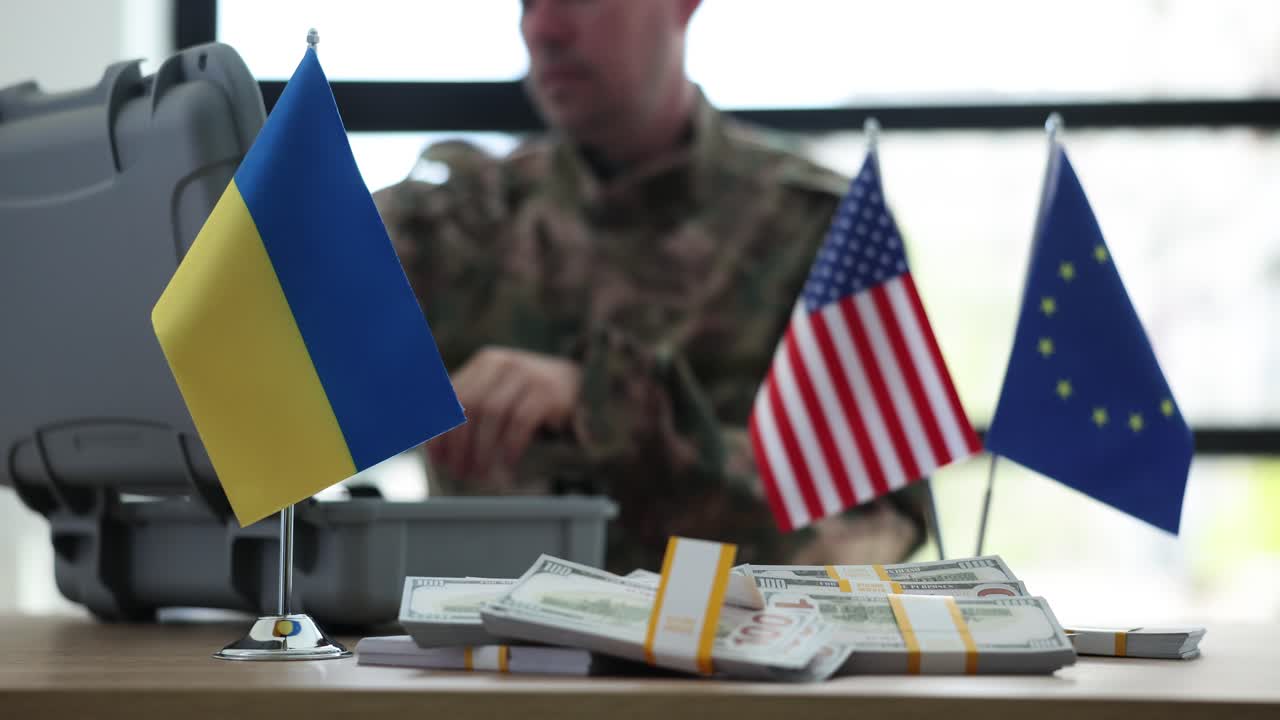 Soldier with Ukraine, US, and EU flags, and stacks of US dollars, symbolizing international financial aid