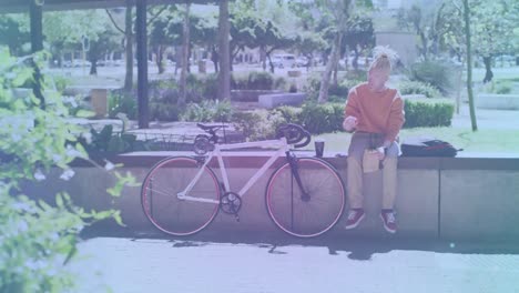 animación de formas que se mueven sobre un hombre afroamericano albino sentado con una bicicleta