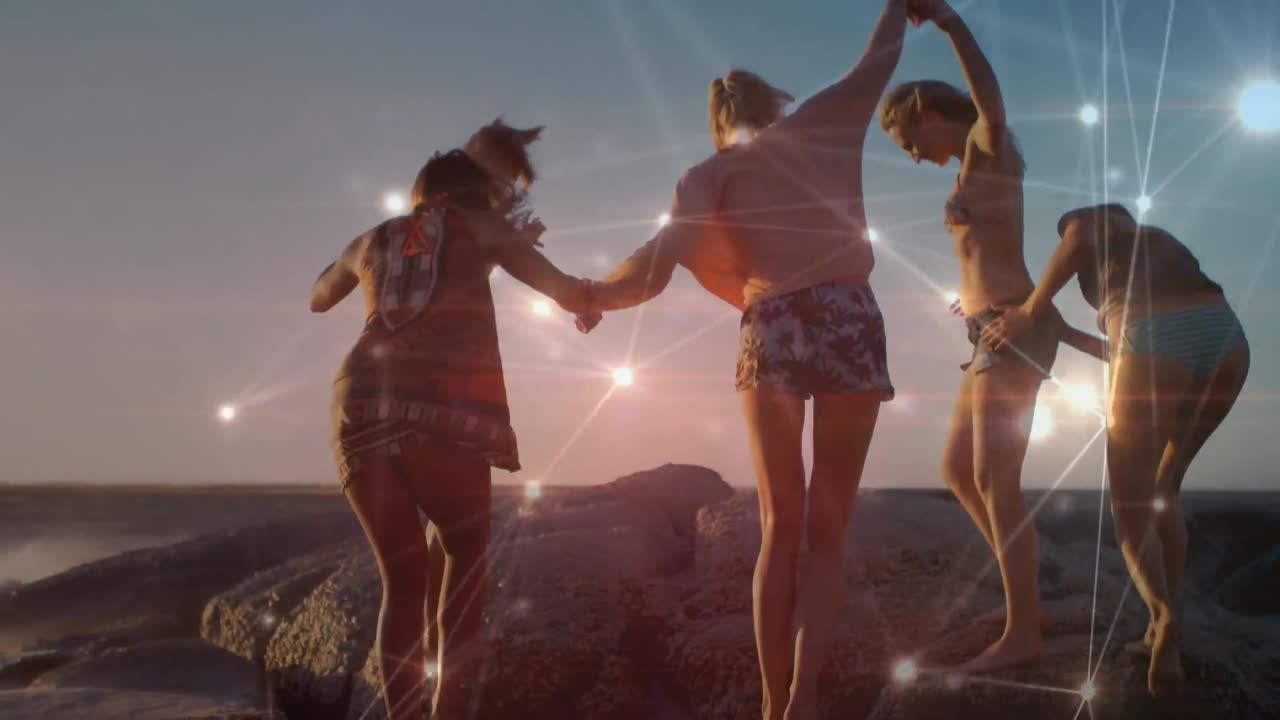 해변을 따라  ⁇ 는 즐거운 친구들의 행복한 그룹에 대한 연결 네트워크의 애니메이션