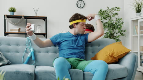 funny man taking a selfies on the couch