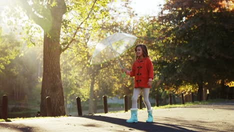 girl having fun outdoors with umbrella