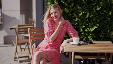 woman enjoying coffee at an outdoor cafe