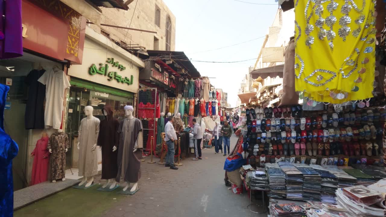 Vibrant Market Street with People Shopping for Traditional Clothes and Goods