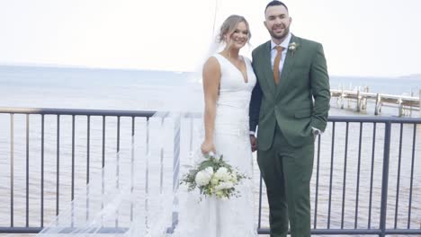 Bride-and-groom-laugh-and-pose-for-photo