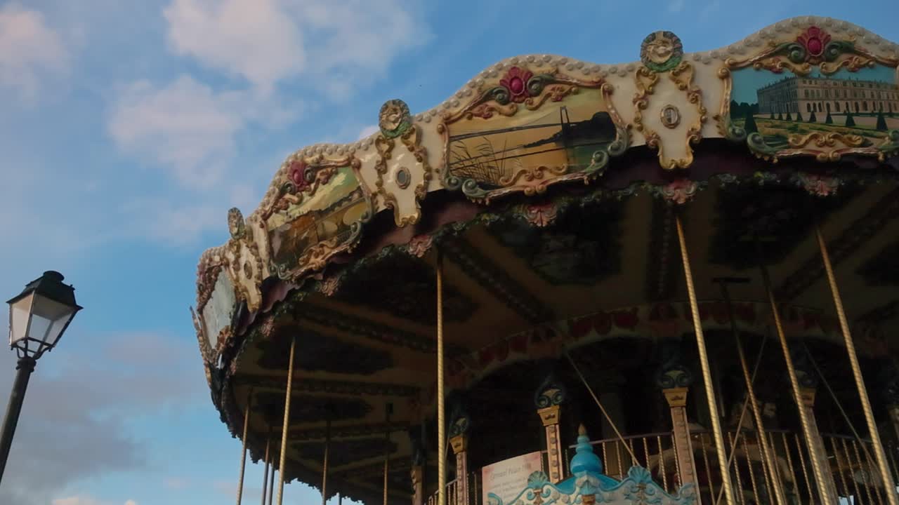Vintage carousel in Honfleur, Normandy, France with evening sky background