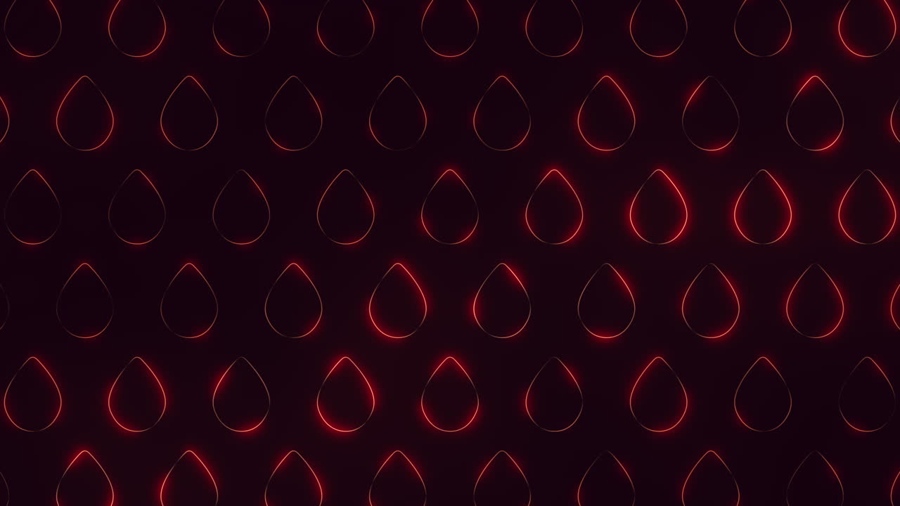 las gotas rojas que caen crean un cautivador patrón circular sobre un fondo oscuro