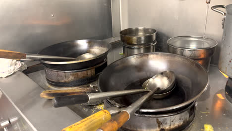 chinese takeaway restaurant, cooking stove,oven professional kitchen wok and flames