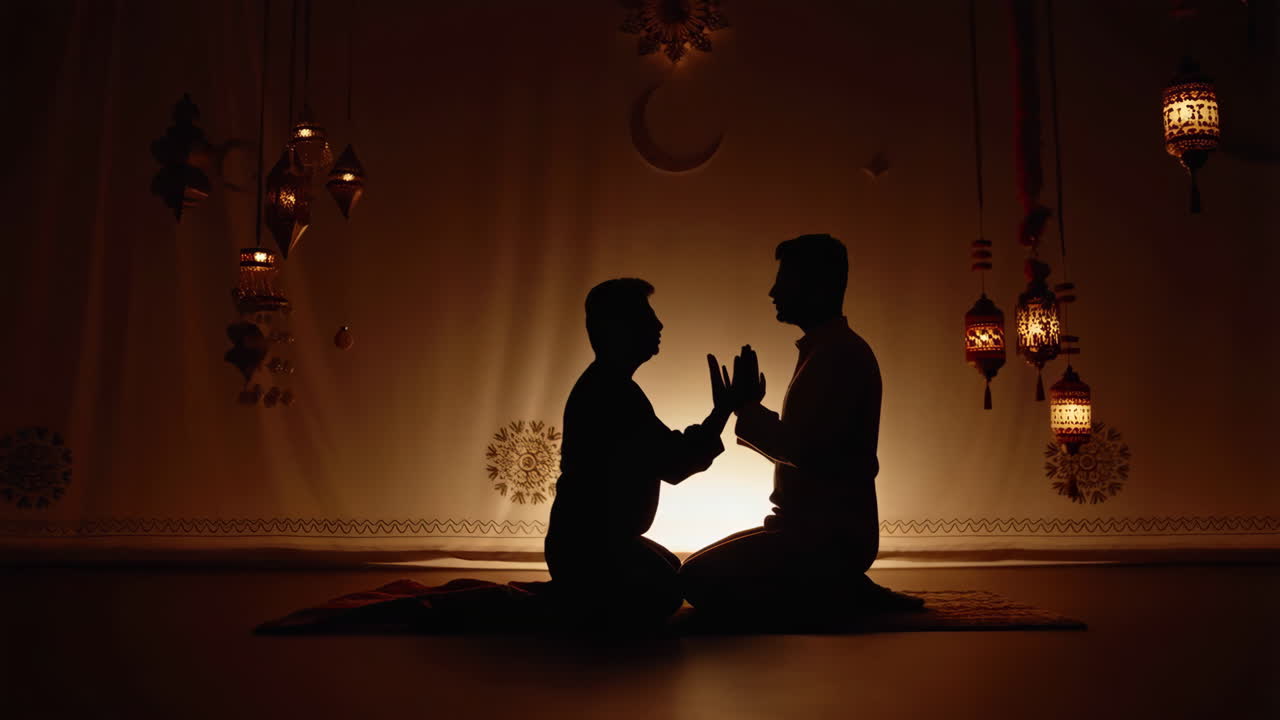 Two Silhouetted Figures Praying in a Warmly Lit Islamic Setting