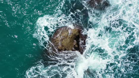 Limestone-cliffs-splashed-by-ocean-turquoise-water,-beautiful-dramatic-scenery-on-coastline-of-Cambodia