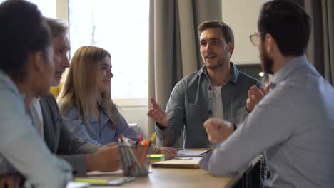 team leader explaining new project, business people corporate team coworkers having fun talking in office