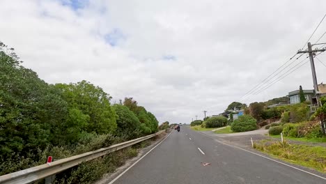 a 14-second video captures a drive along the great ocean road, showcasing coastal views, greenery, and overcast skies