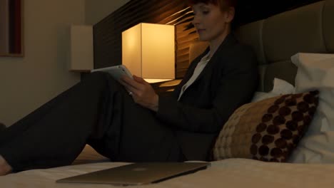 side view of mid-adult caucasian businesswoman working on digital tablet in a modern hotel 4k