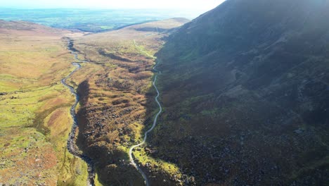 ireland mountains drone flying down mahon valley over trail and mahon river epic landscapes comeragh mountains waterford