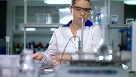 scientist woman in science laboratory. woman in lab coat. female scientist