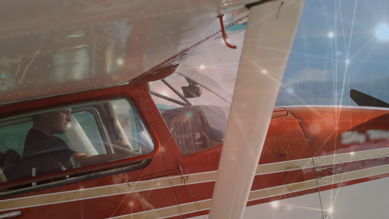 개인 항공기에 앉아있는 백인 조종사에 대한 연결의 빛나는 네트워크