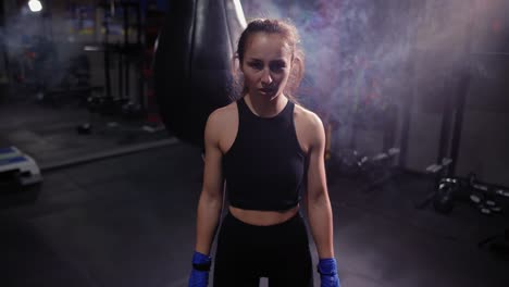 Female-Boxer-Looking-At-The-Camera-In-Bandages-And-Screaming