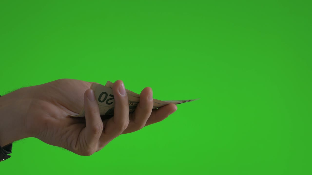 Dare e mostrare denaro su green screen