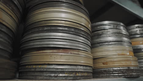 Old-round-metal-boxes,-in-a-dusty-vault-and-leaves