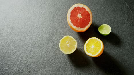 halved citrus fruit on grey background 4k