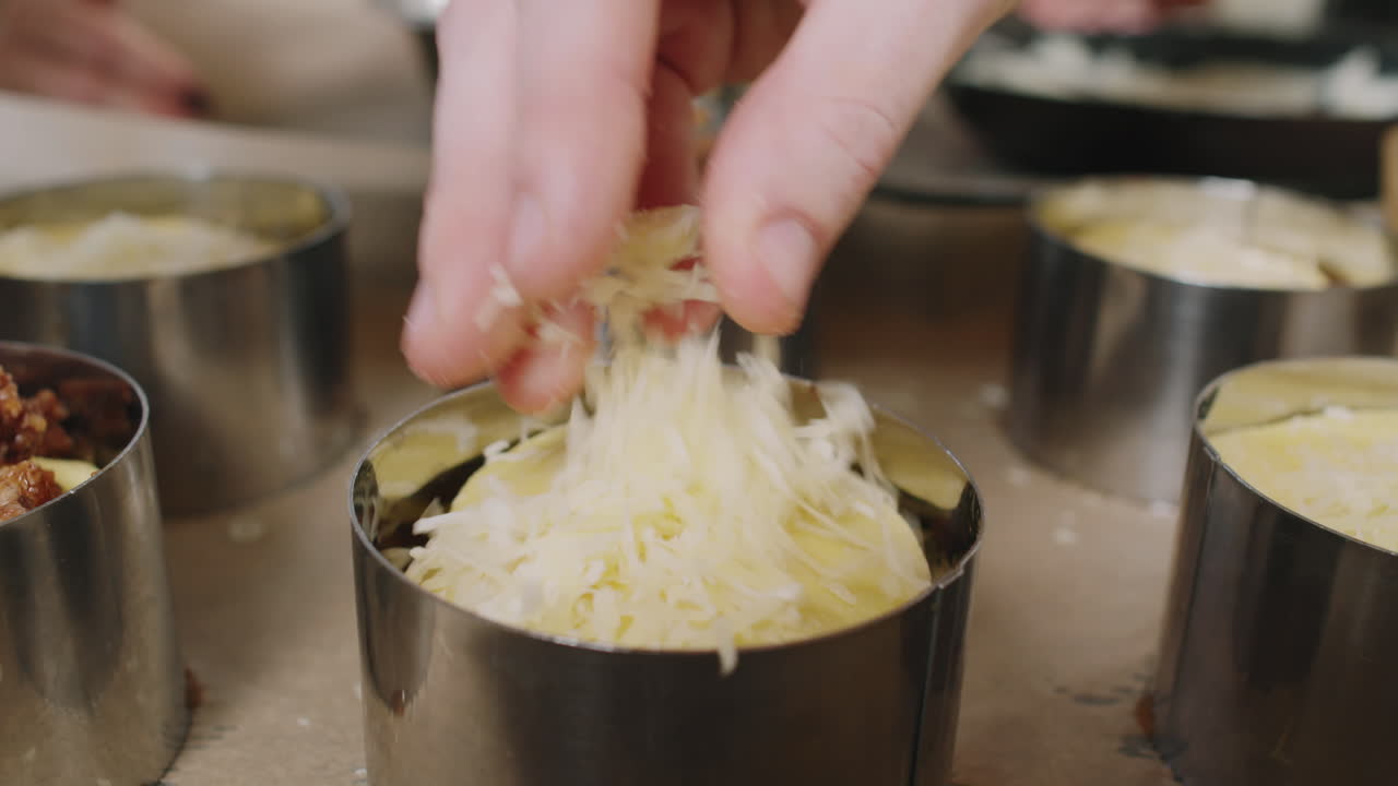 Preparing food with cheese in ring molds