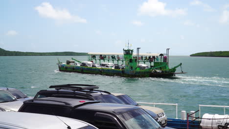 car ferry boat transporting people and vehicles in koh samui