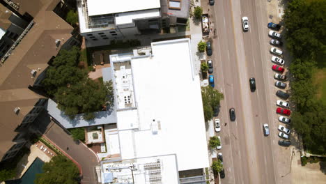 aerial birds eye view traffic through urban developing area in big city, drone 4k