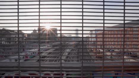 wide skyline view of passing train at station brussel-kapellekerk in brussels, belgium