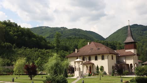 Ancient-Lupsa-Monastery-In-Alba-County-With-A-View-Of-Apuseni-Mountains-In-Romania