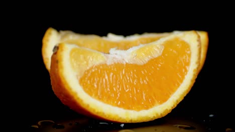 fresh slices of orange slowly rotating.