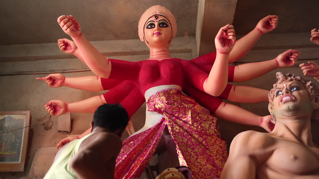 In Kumortuli, idol artists are making idols of Durga, the revered deity of Hinduism. The work of making these idols starts from June and these potters make many idols till November.