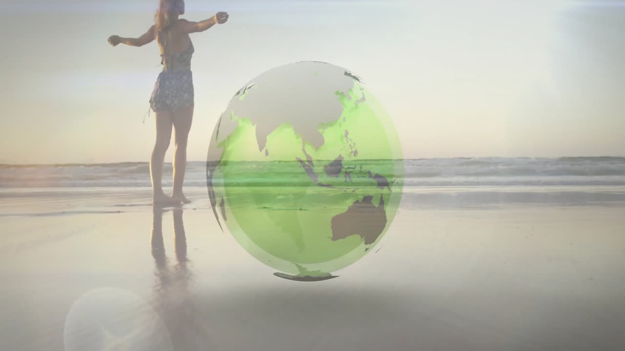 Mulher caminhando descalça na orla aciona um globo 3D giratório, revelando um mapa-múndi para viagens.