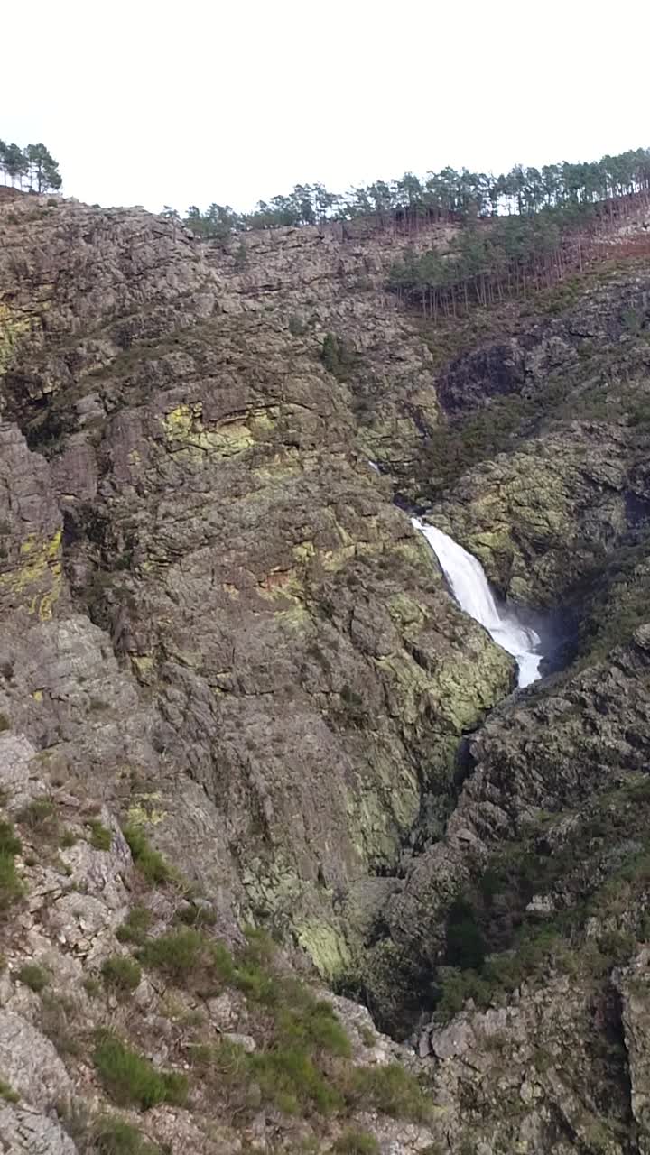 Stunning Waterfall in a Rocky Mountain Landscape