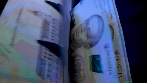 ukrainian hryvnia bills being processed by a counting machine
