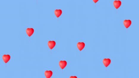 multiple heart balloons moving against blue background